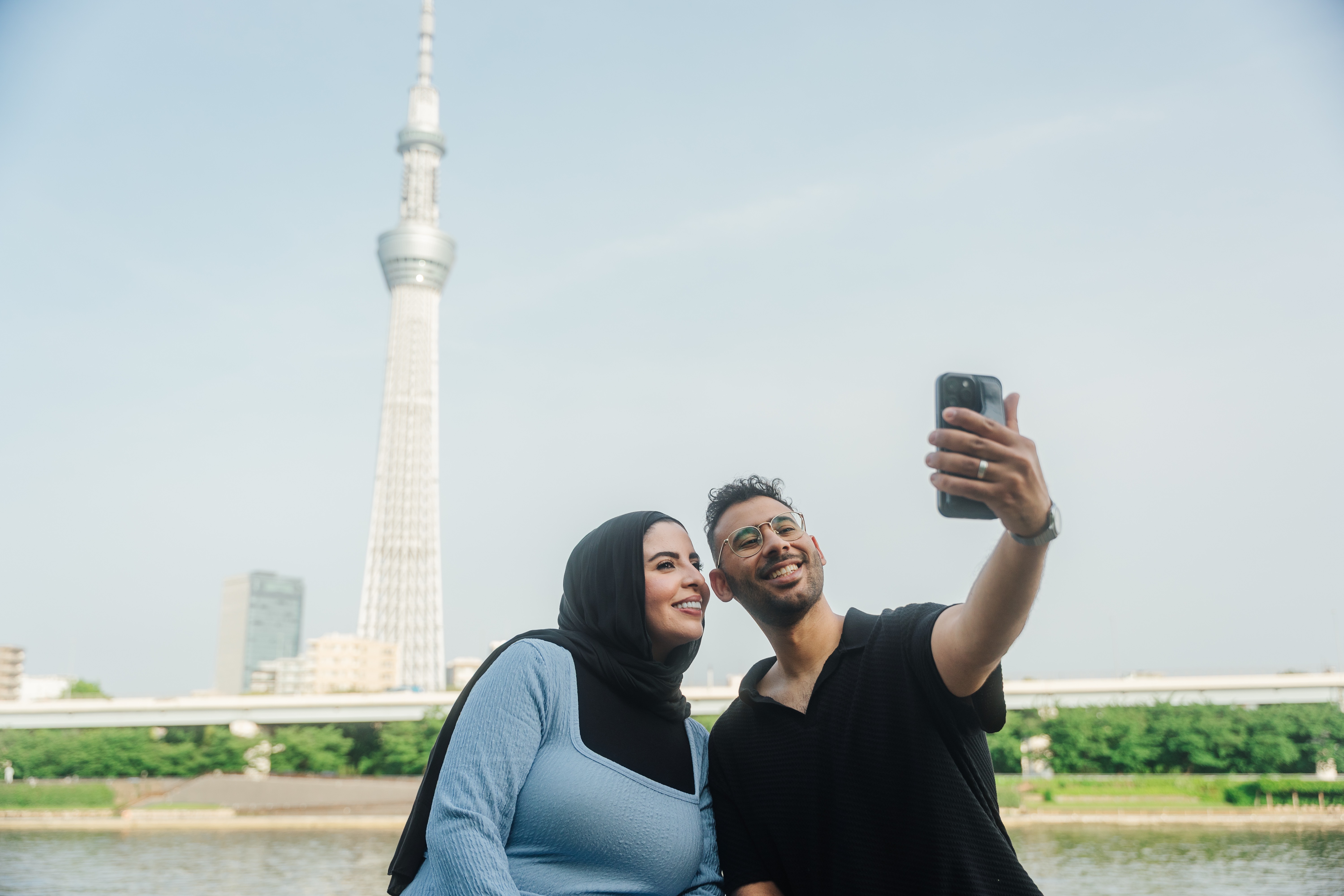 Couple taking selfie with Tokyo Skytree - fun modern photography